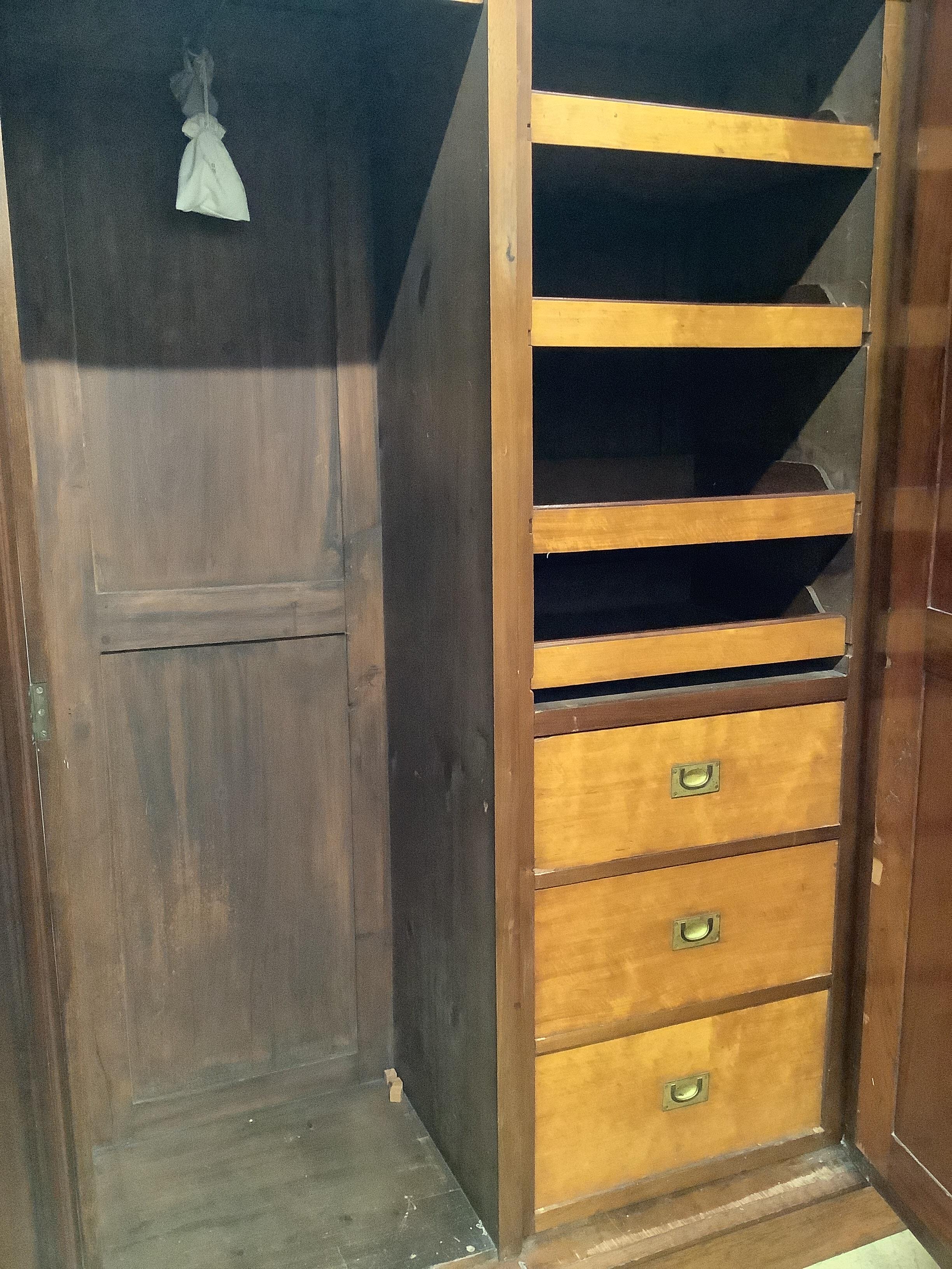 A late Victorian aesthetic movement mahogany and satin birch compactum wardrobe, width 186cm, depth 56cm, height 211cm